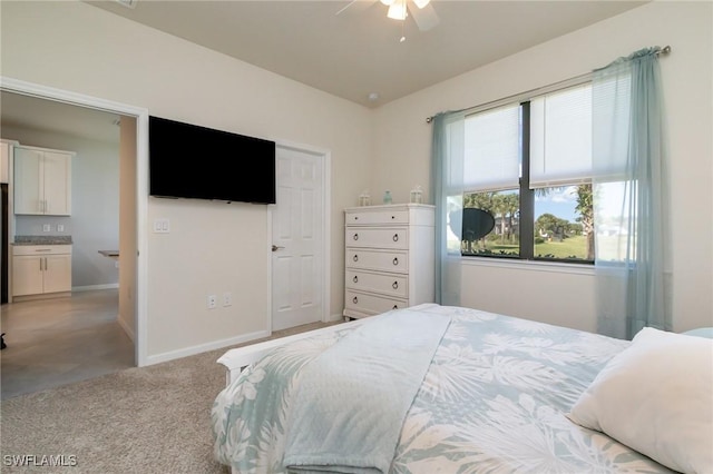 carpeted bedroom featuring baseboards and a ceiling fan
