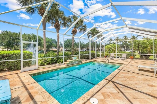 2783 Island Pond Ln, Naples, FL 34119 - pool with a lanai and a patio