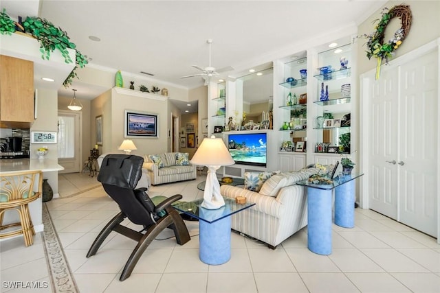 2783 Island Pond Ln, Naples, FL 34119 - living area with light tile patterned floors, ceiling fan, and crown molding