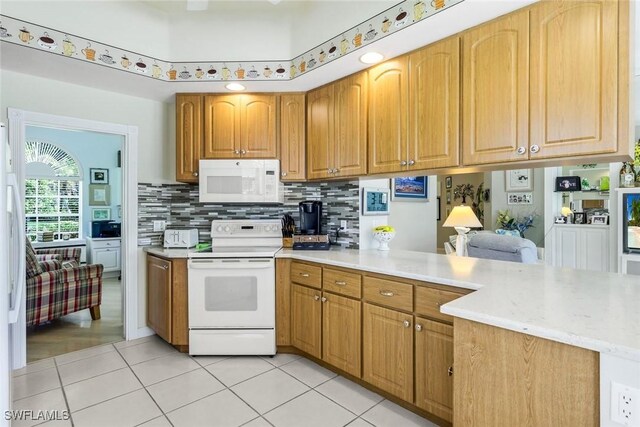 2783 Island Pond Ln, Naples, FL 34119 - kitchen featuring brown cabinetry, white appliances, light tile patterned floors, backsplash, and a peninsula