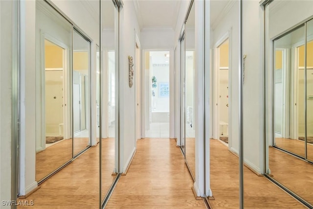 2783 Island Pond Ln, Naples, FL 34119 - corridor featuring light wood-style floors and ornamental molding