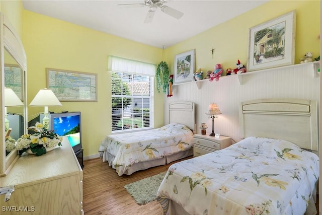 2783 Island Pond Ln, Naples, FL 34119 - bedroom with wood finished floors and a ceiling fan