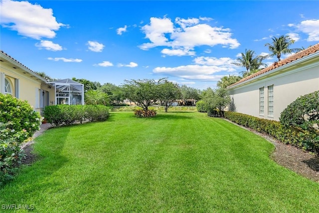 2783 Island Pond Ln, Naples, FL 34119 - view of yard with a lanai