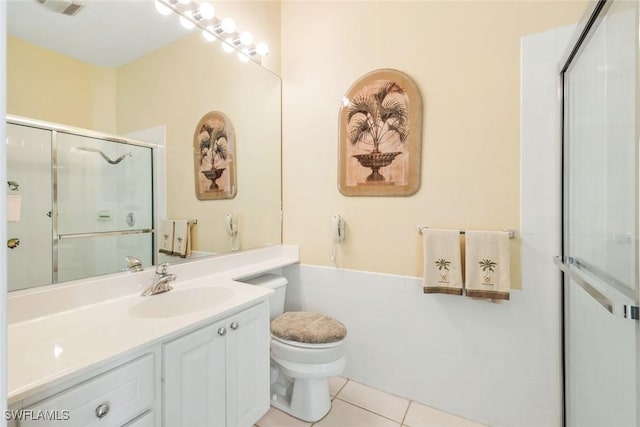 2783 Island Pond Ln, Naples, FL 34119 - bathroom featuring tile patterned floors, a shower with door, visible vents, toilet, and vanity