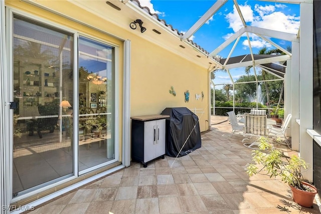 2783 Island Pond Ln, Naples, FL 34119 - view of patio / terrace with a grill and glass enclosure