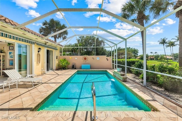 2783 Island Pond Ln, Naples, FL 34119 - pool featuring glass enclosure and a patio