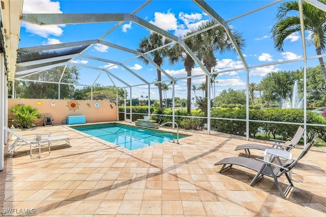 2783 Island Pond Ln, Naples, FL 34119 - outdoor pool featuring a patio area and glass enclosure