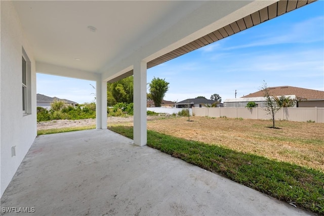 view of patio / terrace featuring fence