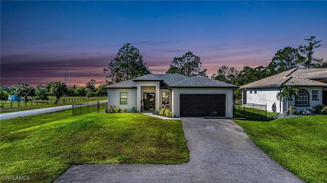 1990 47th Ave NE, Naples, FL 34120 - view of front of property featuring an attached garage, fence, stucco siding, and a lawn