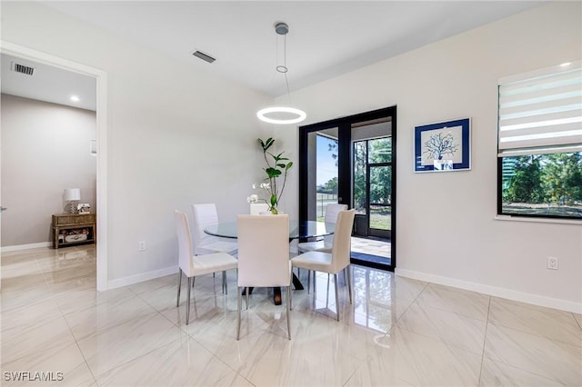 1990 47th Ave NE, Naples, FL 34120 - dining room with baseboards, visible vents, and marble finish floor