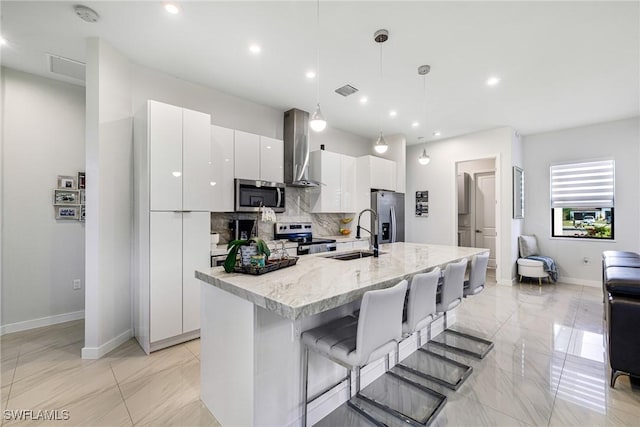 1990 47th Ave NE, Naples, FL 34120 - kitchen featuring tasteful backsplash, a sink, extractor fan, stainless steel appliances, and white cabinetry