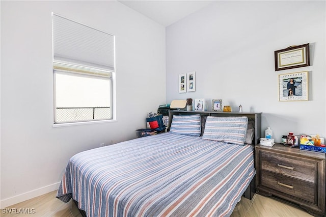 1990 47th Ave NE, Naples, FL 34120 - bedroom with baseboards and light wood-style flooring