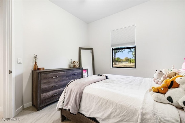 1990 47th Ave NE, Naples, FL 34120 - bedroom with lofted ceiling and baseboards