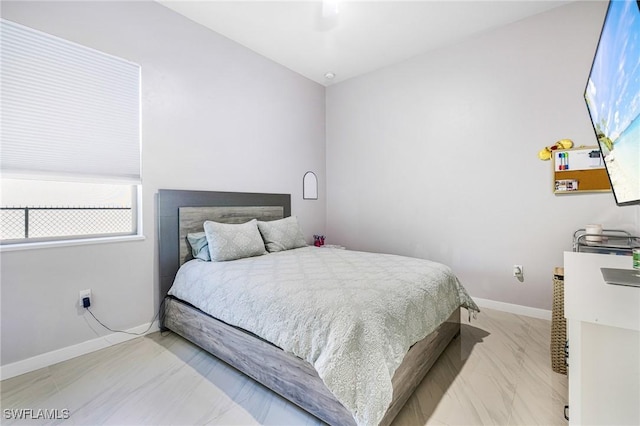 1990 47th Ave NE, Naples, FL 34120 - bedroom with ceiling fan, baseboards, and marble finish floor