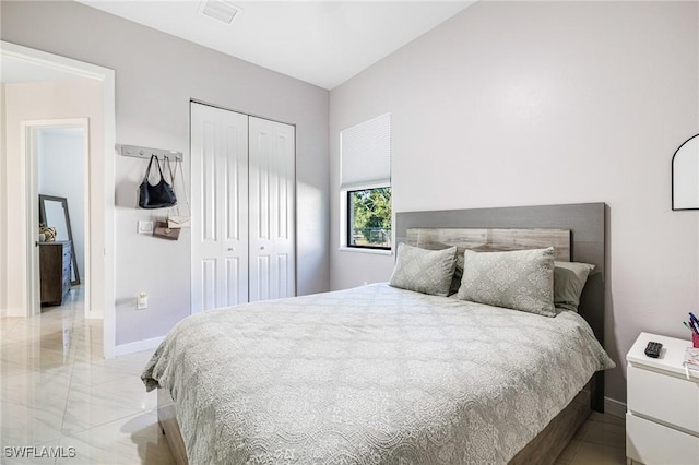1990 47th Ave NE, Naples, FL 34120 - bedroom featuring baseboards, visible vents, and a closet