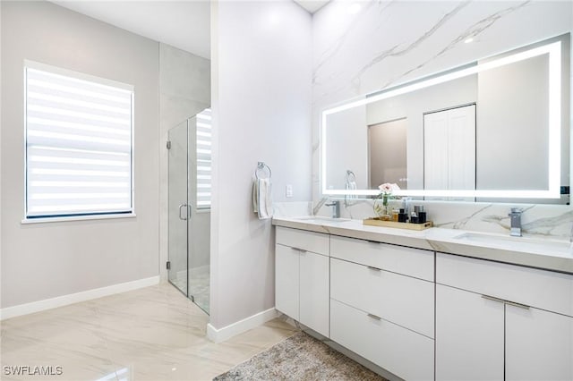 1990 47th Ave NE, Naples, FL 34120 - full bath featuring baseboards, marble finish floor, a sink, and a stall shower