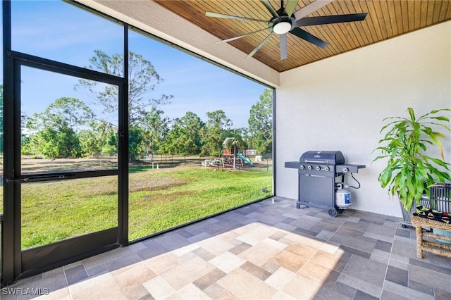 1990 47th Ave NE, Naples, FL 34120 - unfurnished sunroom with ceiling fan