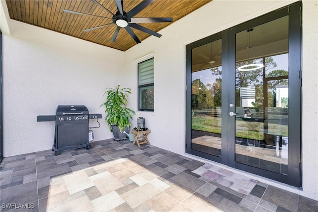 1990 47th Ave NE, Naples, FL 34120 - view of patio featuring a ceiling fan and french doors