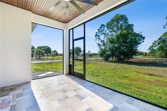 1990 47th Ave NE, Naples, FL 34120 - unfurnished sunroom with ceiling fan