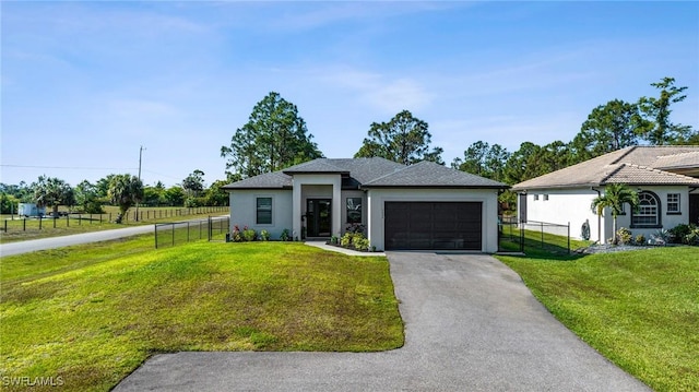 1990 47th Ave NE, Naples, FL 34120 - prairie-style house featuring stucco siding, a front lawn, fence, and a garage