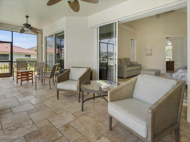 exterior space with an outdoor living space, a wealth of natural light, and a ceiling fan