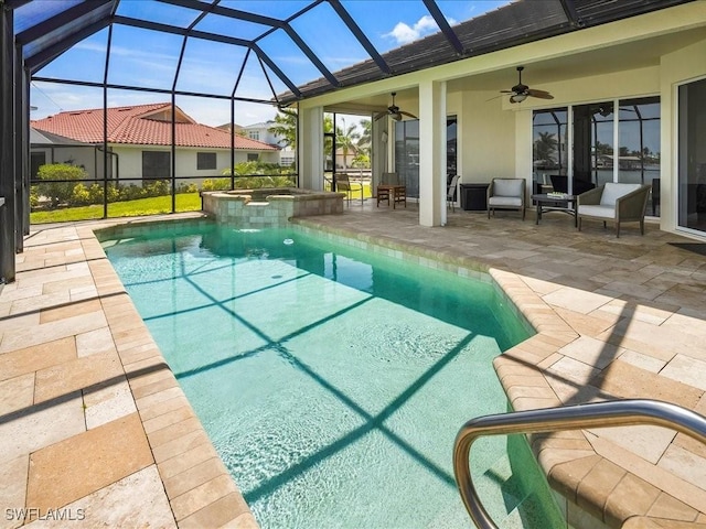 view of swimming pool featuring ceiling fan, glass enclosure, a pool with connected hot tub, and a patio