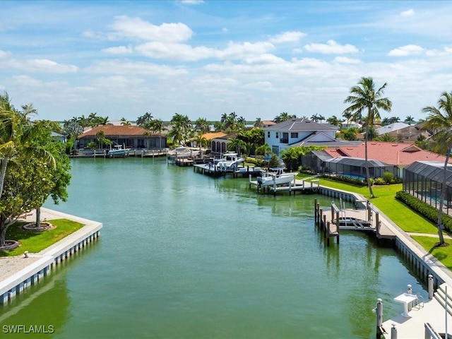property view of water with a dock and a residential view