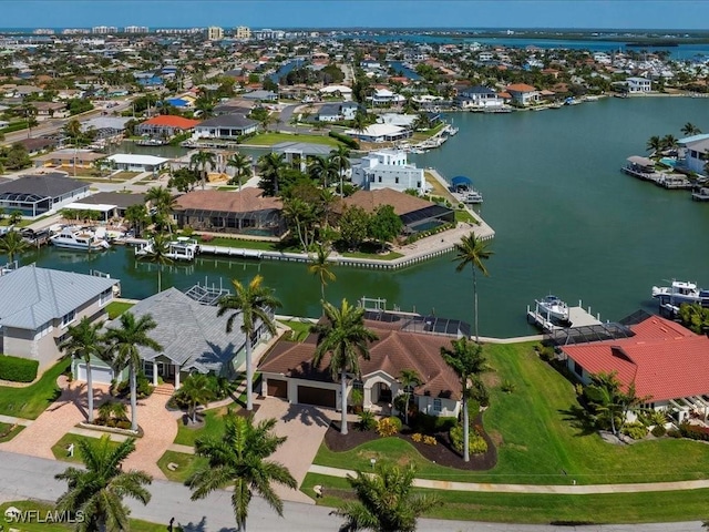 bird's eye view with a residential view and a water view