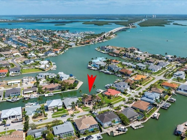 aerial view featuring a residential view and a water view