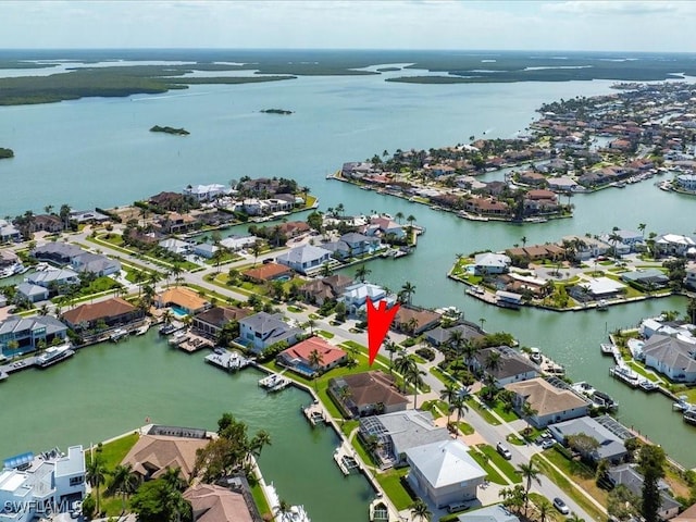 bird's eye view featuring a residential view and a water view