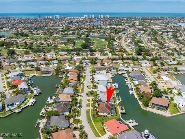 bird's eye view with a water view and a residential view
