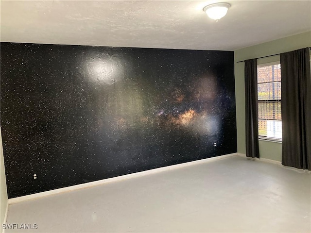 191 Round Key Cir Unit D2, Naples, FL 34112 - unfurnished room featuring baseboards and finished concrete floors