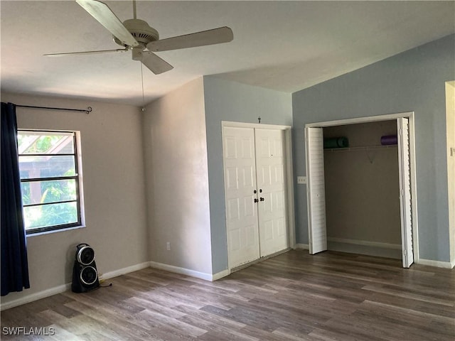 191 Round Key Cir Unit D2, Naples, FL 34112 - unfurnished bedroom with wood finished floors, a closet, and ceiling fan