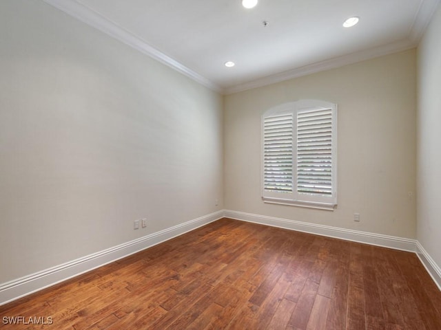 28561 Calabria Ct Unit 102, Naples, FL 34110 - spare room with crown molding, baseboards, dark wood finished floors, and recessed lighting
