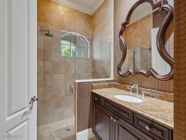 28561 Calabria Ct Unit 102, Naples, FL 34110 - bathroom with a stall shower, vanity, and ornamental molding