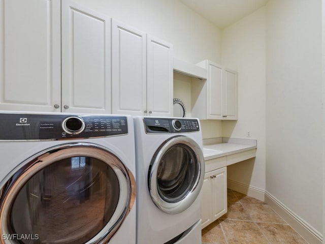 28561 Calabria Ct Unit 102, Naples, FL 34110 - laundry area with independent washer and dryer, cabinet space, and baseboards