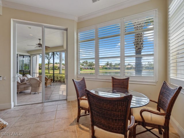 28561 Calabria Ct Unit 102, Naples, FL 34110 - dining area with a ceiling fan, crown molding, baseboards, and light tile patterned floors