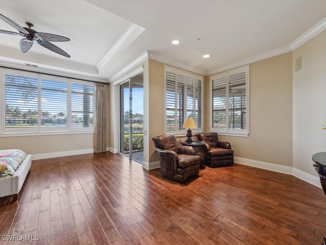 28561 Calabria Ct Unit 102, Naples, FL 34110 - sitting room featuring crown molding, hardwood / wood-style flooring, plenty of natural light, a ceiling fan, and baseboards