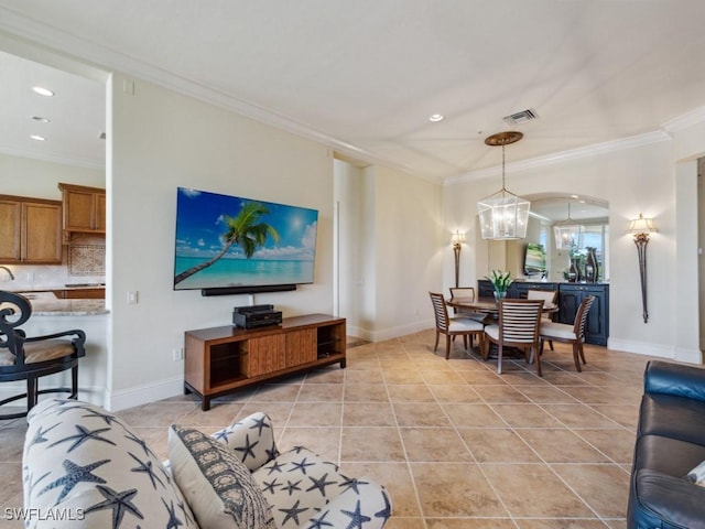 28561 Calabria Ct Unit 102, Naples, FL 34110 - living room featuring a chandelier, ornamental molding, recessed lighting, light tile patterned floors, and baseboards