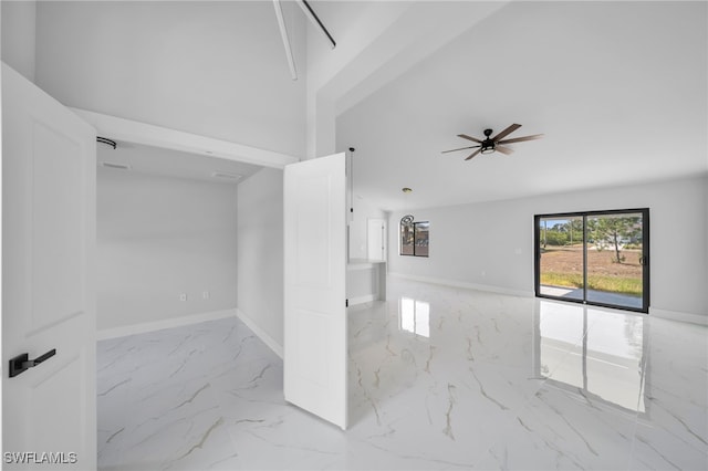 2603 36th St SW, Lehigh Acres, FL 33976 - unfurnished room featuring marble tiled floors, ceiling fan, and baseboards