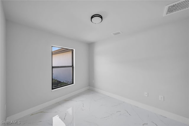 2603 36th St SW, Lehigh Acres, FL 33976 - empty room with baseboards and marble finish floors