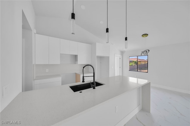 2603 36th St SW, Lehigh Acres, FL 33976 - kitchen featuring a sink, white cabinets, modern cabinets, light marble finish flooring, and hanging light fixtures