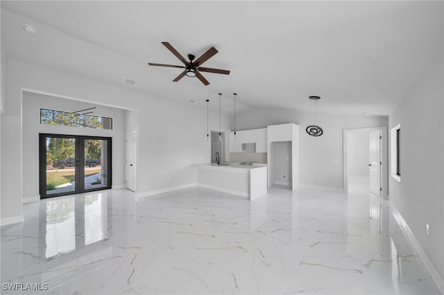 2603 36th St SW, Lehigh Acres, FL 33976 - unfurnished living room with baseboards, french doors, lofted ceiling, a ceiling fan, and light marble finish floors