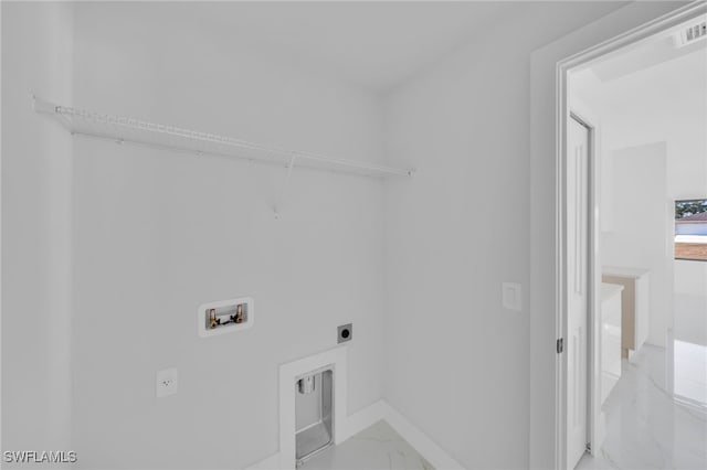 2603 36th St SW, Lehigh Acres, FL 33976 - washroom with light marble finish floors, electric dryer hookup, hookup for a washing machine, and baseboards