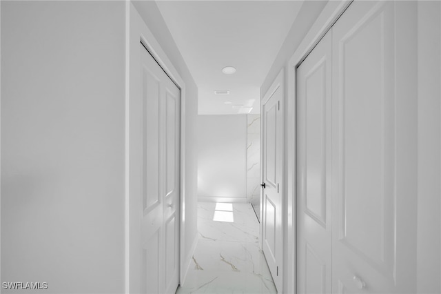 2603 36th St SW, Lehigh Acres, FL 33976 - corridor with light marble finish flooring, baseboards, and recessed lighting