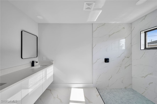 2603 36th St SW, Lehigh Acres, FL 33976 - full bathroom with marble tiled floors, vanity, and a marble finish shower