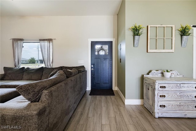 7717 16th Ter, Labelle, FL 33935 - foyer featuring wood finished floors and baseboards