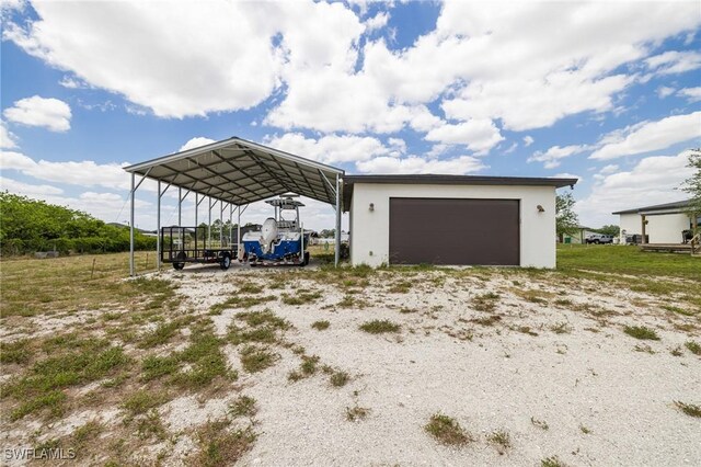 7717 16th Ter, Labelle, FL 33935 - garage with a detached garage and a carport