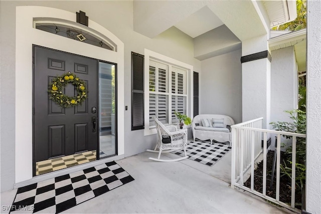 1518 Mcgregor Reserve Dr, Fort Myers, FL 33901 - doorway to property with stucco siding and a porch