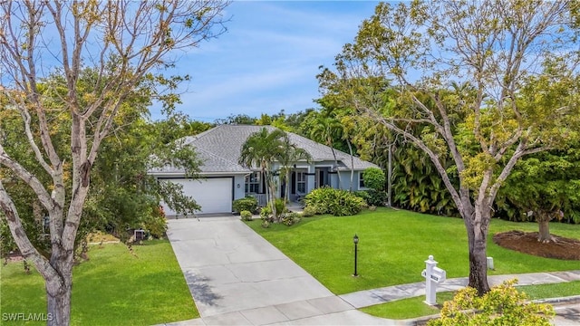 1518 Mcgregor Reserve Dr, Fort Myers, FL 33901 - ranch-style house featuring an attached garage, a front yard, concrete driveway, stucco siding, and a shingled roof